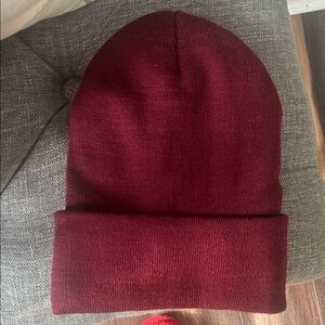 Cozy burgundy knit beanie with furry type fabric inside. NWOT